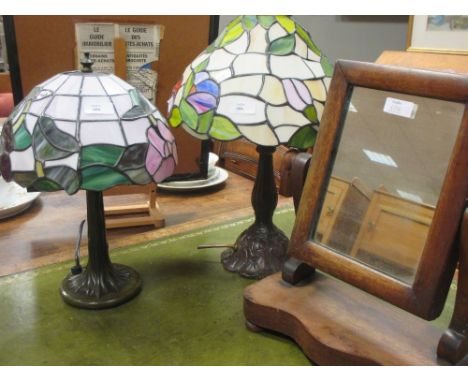 A Tiffany style table lamp together with another similar, a Victorian toiletry mirror, two stools, a circular coffee table, a