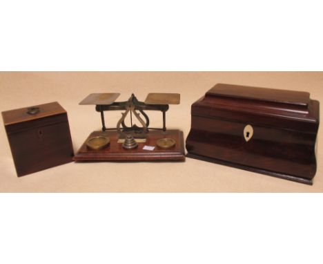 Two 19th century mahogany tea caddies and a set of postal scales  