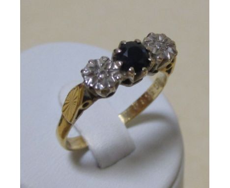 An 18ct sapphire and gypsy set diamond ring, size P and a three stone opal and sapphire cluster ring, marks worn, size Q (2) 