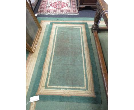 A large green Donegal carpet, 458 x 350cm with another smaller, 160 x 95cm, with cotton label 'Donegal handcrafted carpet' (2