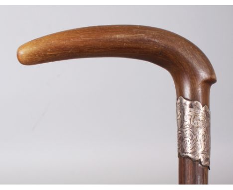 A HORN HANDLED BAMBOO WALKING STICK, with an engraved and hallmarked silver collar, the horn possibly rhinoceros horn, 30.6in