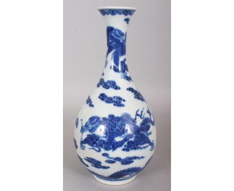 A CHINESE BLUE & WHITE PORCELAIN DRAGON BOTTLE VASE, the base with a Qianlong seal mark, 11.2in high.