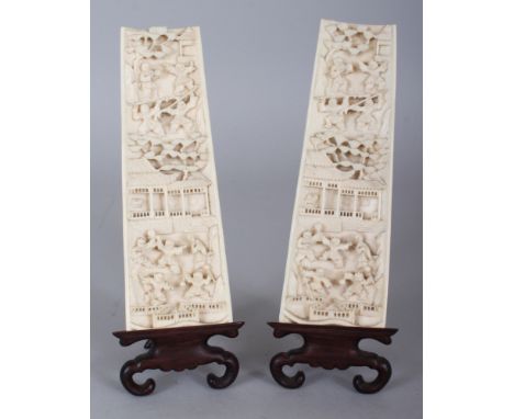 A PAIR OF GOOD QUALITY EARLY 20TH CENTURY CHINESE IVORY WRIST RESTS, together with fitted wood display stands, each interior 