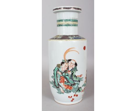 A CHINESE KANGXI STYLE FAMILLE VERTE PORCELAIN ROULEAU VASE, decorated with a group of four animated monks, 12.75in high.