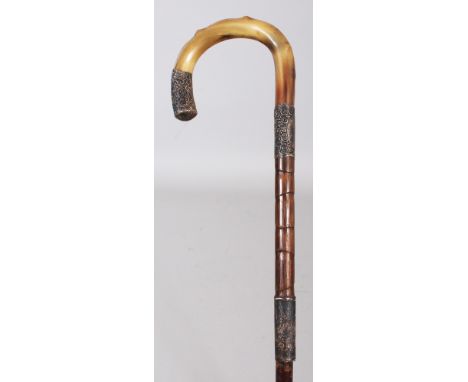 A HORN HANDLED BAMBOO WALKING STICK, with an engraved and hallmarked silver waistband and a matching silver-metal collar and 