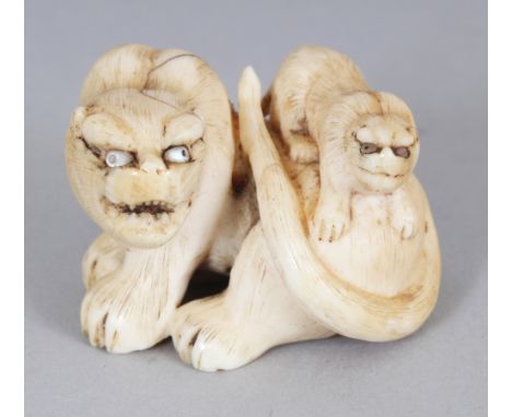 A SIGNED JAPANESE MEIJI PERIOD IVORY OKIMONO OF A TIGER & ITS CUB, the fur naturalistically engraved, the eyes inlaid in moth