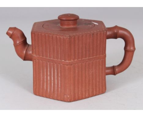 ANOTHER 19TH CENTURY CHINESE YIXING POTTERY TEAPOT & COVER, of hexagonal section ribbed form, the base with an impressed seal