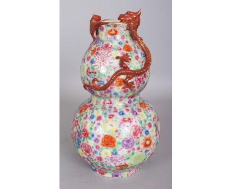 A GOOD QUALITY CHINESE FAMILLE ROSE MILLEFLEUR DOUBLE GOURD PORCELAIN VASE, the shoulders and neck moulded in relief with a b