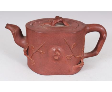 ANOTHER 19TH CENTURY CHINESE YIXING POTTERY TEAPOT & COVER, the irregularly shaped body moulded in relief with sprigs of plum