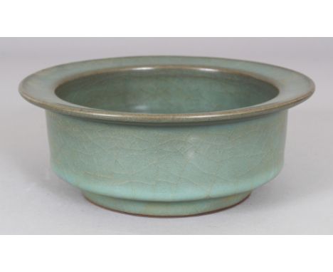 A CHINESE JUN WARE CERAMIC BOWL, with a flanged rim, 6.7in diameter & 2.6in high.
