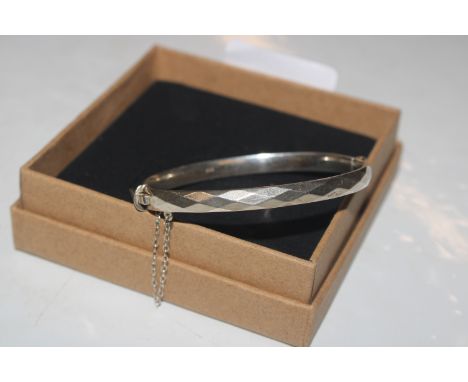 A Hallmarked Sterling silver hinged bangle, approx. 19gms 