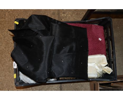 A box containing various material and curtains 