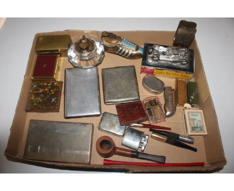 A box of smoking related items to include pipe, cigarette cases, lighters etc.