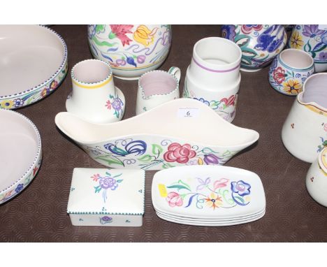 A Poole pottery "Bluebird" pattern flower trough; two vases; a cream jug; four side plates; and a box and cover 