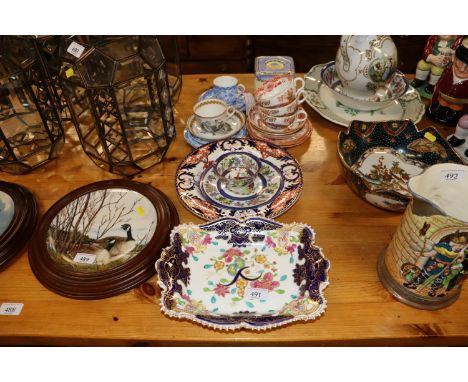 A collection of various 19th Century and later porcelain to include tea cups and saucers, Imari pattern plates, Art Deco cube