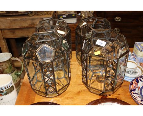 A set of four decorative light shades 