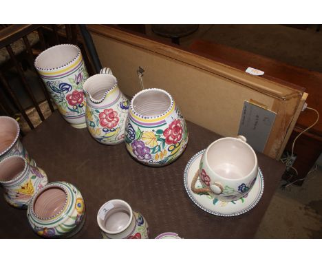 Two Poole pottery yellow and bluebird decorated vases; a similar baluster jug; biscuit barrel (lid missing) and a plate