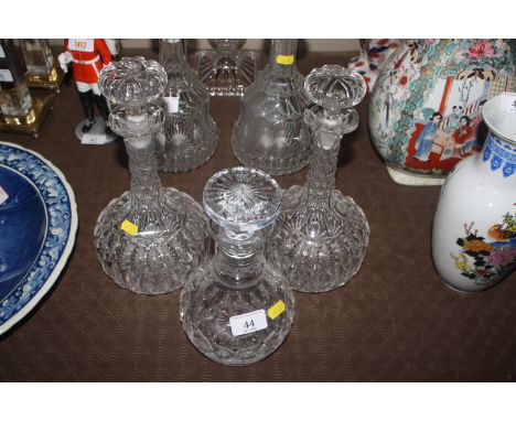 A pair of cut glass decanters and a ring neck cut glass decanter  AF