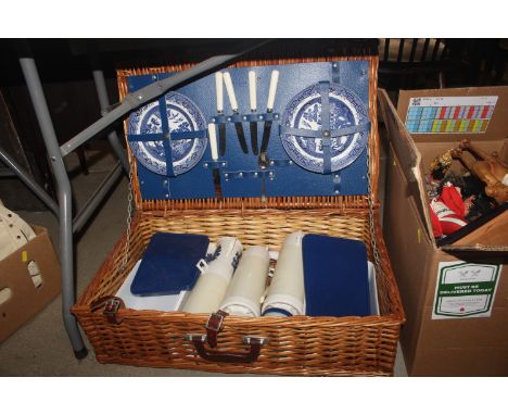 A wicker cased picnic hamper set