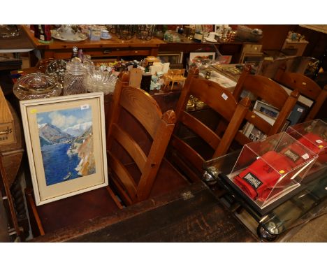 A set of four pine ladder back dining chairs 