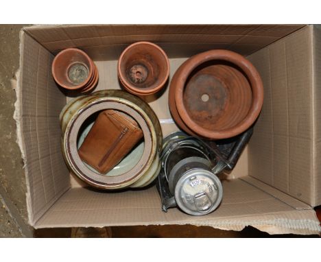 A Hurricane lamp; terracotta flower pots; a flat iron; stoneware pots etc.