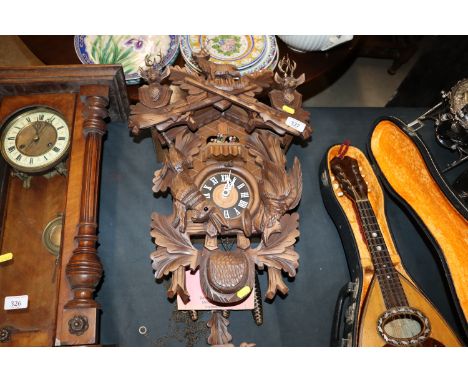 A handmade Black Forest type cuckoo clock, vendor reports from 'The House of 1000 Clocks' in the Black Forest circa 1981