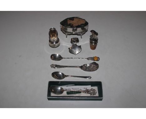 A silver trinket box with pin cushion lid; two bottle pourers; a bottle topper; a Polish silver spoon; a preserve spoon; and 