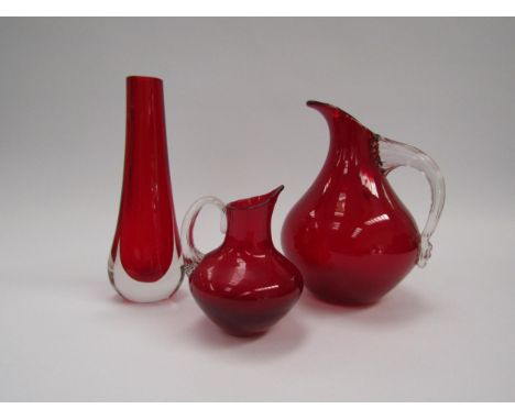 Two Whitefriars ruby red glass jugs and a Whitefriars cased red glass vase. Tallest 20.5cm