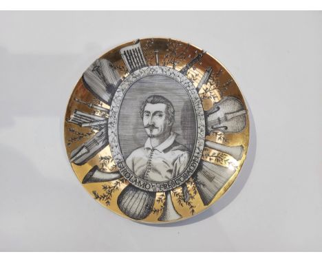 A Fornasetti Milano gilded cabinet plate with “Girolamo Frescobaldi” portrait. 26cm diameter 