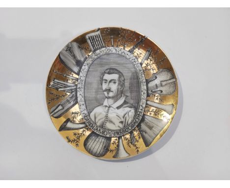 A Fornasetti Milano gilded cabinet plate with “Girolamo Frescobaldi” portrait. 26cm diameter 