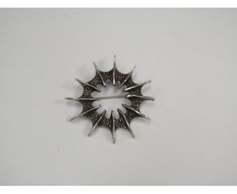 A Mid 20th Century Norwegian silver splash brooch with pendant loop fitting to revere by Else and Paul Hughes. (Exhibited in 