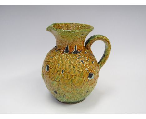 A French Mid 20th Century Le Cyclope studio ceramic jug by Charles Cart with yellow and green "blistered" glaze. 19.5cm high 