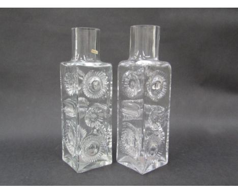 A pair of Kosta Boda clear glass lamp bases by Ove Sandeberg, each 35cm high, label to one. (Chip to the base corner of one.)