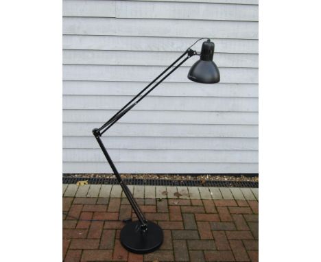 A floor standing angle poised adjustable lamp in black 