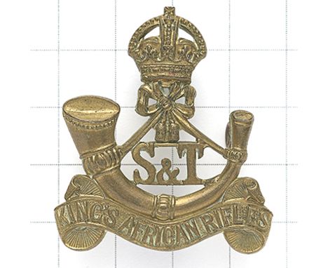 King’s African Rifles Supply &amp; Transport Section scarce pre 1953 cap badge. Die-cast crowned strung bugle on title scroll