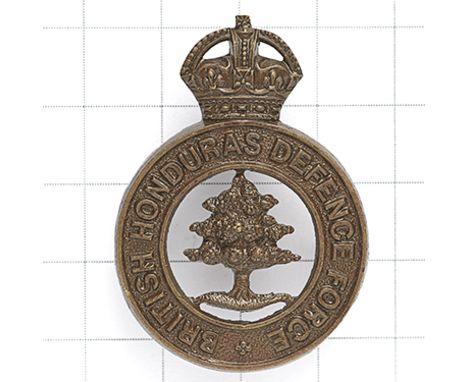 British Honduras Defence Force bronze cap badge circa 1928-44. British made die-stamped crowned title circlet; mahogany tree 