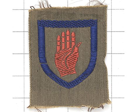 245 Heavy Anti-Aircraft Regt. Royal Artillery cloth fomation sign. Silk embroidered  Red Hand of Ulster within a blue shield 