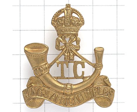 King’s African Rifles Training Company pre 1953 cap badge. Scarce die-cast crowned strung bugle on title scroll, ‘TC’ lodged 