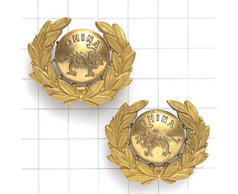 Border Regiment Officer’s facing collar badges circa 1895-1908. Die-stamped gilt ‘button’ bearing “CHINA” over Dragon; laurel
