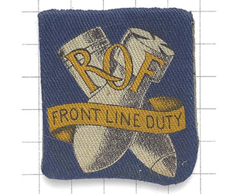 Royal Ordnance Factory WW2 printed cloth badge. Blue rectangle bearing golden yellow lettering ‘ROF’ with scroll “FRONT LINE 