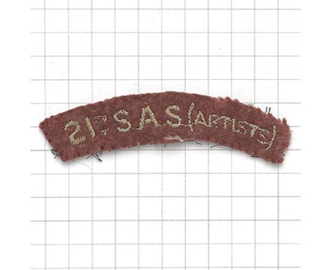 21st S.A.S. (ARTISTS) scarce cloth embroidered shoulder title. Light blue on maroon felt.   Removed from uniform, faded, serv