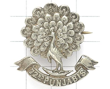 Indian Army 72nd Punjabis Officer’s cap badge circa 1903-22. Well cast native silver peacock resting upon a scroll “72ND PUNJ