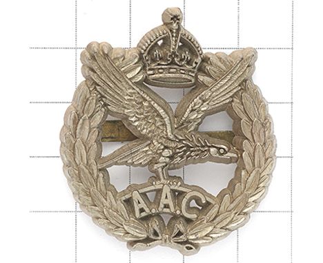 Army Air Corps WW2 plastic economy issue beret badge. Crowned laurel sprays, voided centre with an eagle on ‘AAC’, its upswep