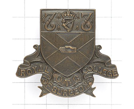 Royal College of Surgeons (Ireland) OTC rare bronze cap badge. Die-stamped shield bearing St.Patrick’s Cross, Hand of Ulster,