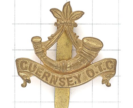 Elizabeth College OTC, Guernsey brass cap badge. Die-stamped Guernsey strung bugle on scroll “GUERNSEY O.T.C”. (KK 2548)  Loo