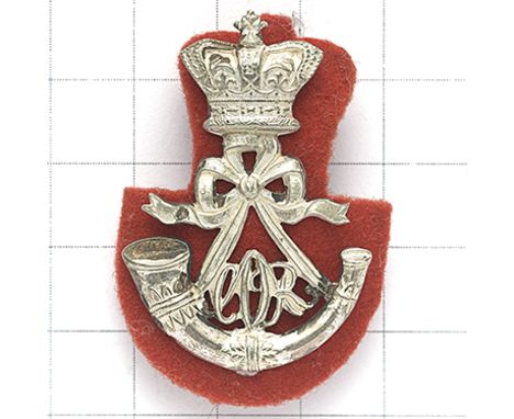 Cape Mounted Rifles Victorian Officer’s cap badge. Die-stamped silvered crowned strung bugle; ‘CMR’ cypher between the cords,