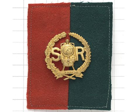 Sudan Railways WW2 rare gilt helmet badge with felt backing. Die-cast railway engine and S R resting in oak and palm sprays w