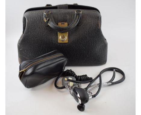 A vintage leather Gladstone bag containing doctor's medical equiptemnt dating to the mid part of the 20th century. Includes s