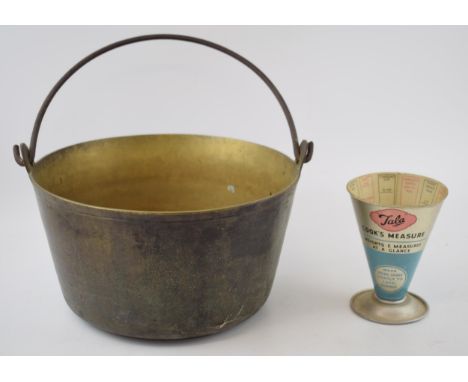 An antique brass jam kettle (diameter 29cm) together with a vintage Tala Cook's measure. Made in England. (2)  In good origin