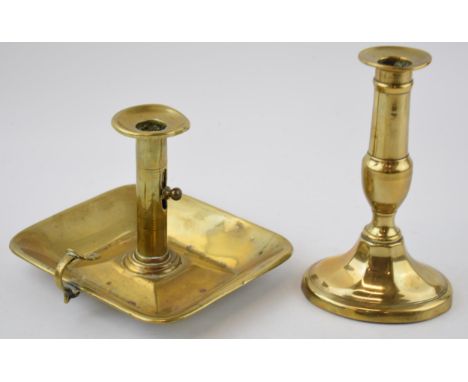 Two 19th century brass candle sticks to include a chamber stick and another similar example. Height 17cm.  In good original c